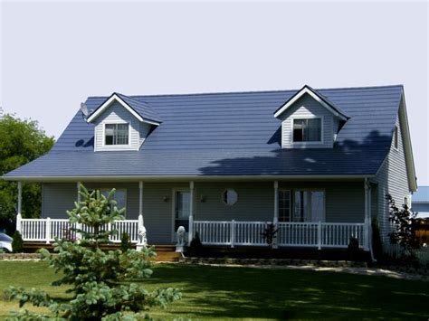 Another popular choice for metal siding colors is to use galvanized steel with light, warm wood tones or natural stone to create an impeccable clean, modern design. Country home with a new permanent lifetime metal roof. In Shake Classic Blue. http://www ...