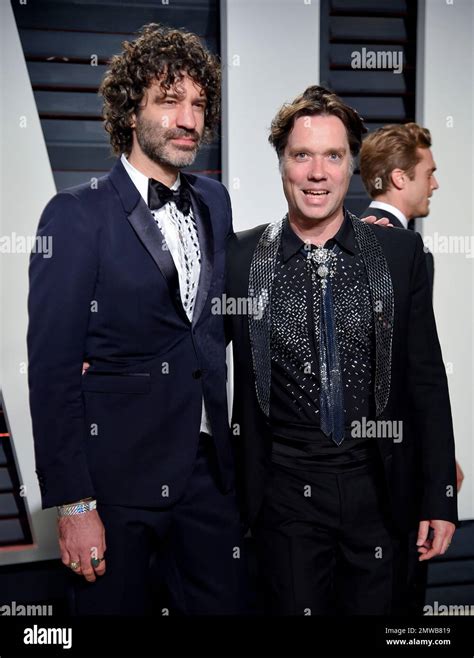Jorn Weisbrodt Left And Husband Rufus Wainwright Arrive At The Vanity Fair Oscar Party On