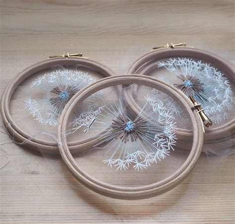 Three Embroidery Hoop With Dandelions On Them