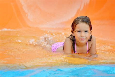 Adorable Toddler Girl On Water Slide At Aquapark Stock Photo Image Of