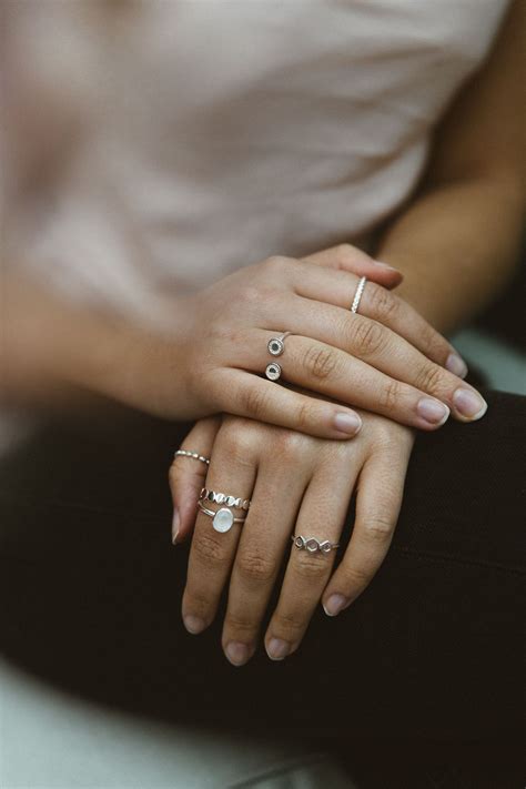 Left hand ring on pinky, (2)middle finger, and thumb Right hand (2 or 3