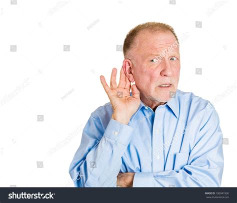 Closeup Portrait Of Senior Mature Nosy Angry Man Hand To Ear Trying