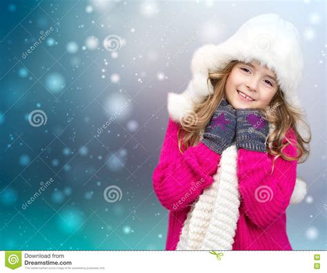 Xmas Child Girl Winter Clothes On Snowy Background Stock