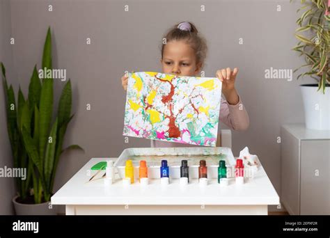 Little Girl Holding Drawing In Ebru Technique Stock Photo Alamy