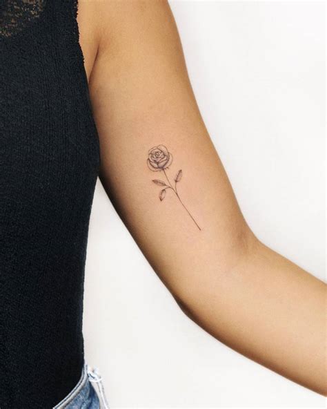 Fine Line Rose Tattoo Located On The Inner Arm