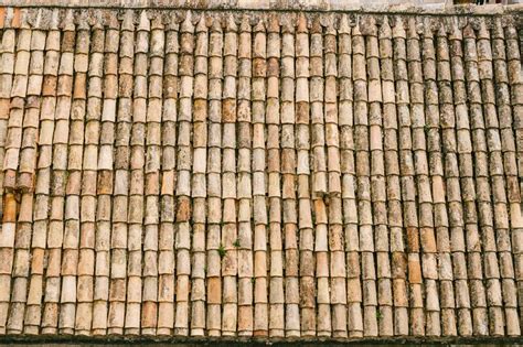 The Texture Of The Old Brown Shingles On The Roof Of The Building