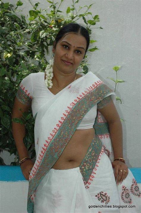 Apoorva Aunty In Hot White Saree Exposing Photos