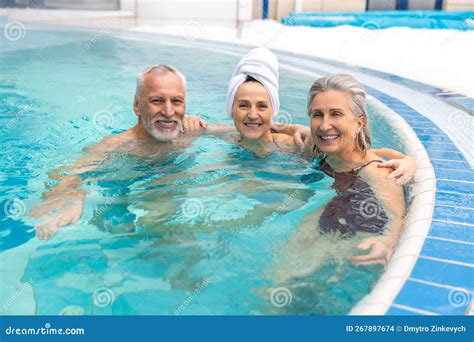 Group Of Seniors In The Swimming Pool Looking Happy And Enjoyed Stock