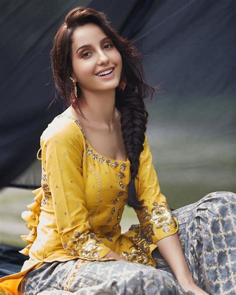 Follow nora fatehi as she shows you an exclusive look of what it took to shoot the music video like and subscribe our channel. Nora Fatehi Latest Images - Glows in a Yellow Outfit - Boxofficeindia, Box Office India, Box ...