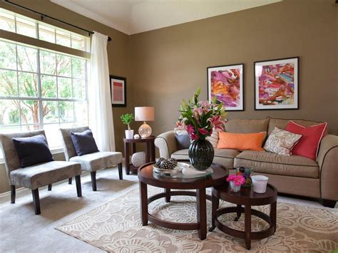 A room with little natural lighting will. This lively living room features an all-over earthy taupe ...