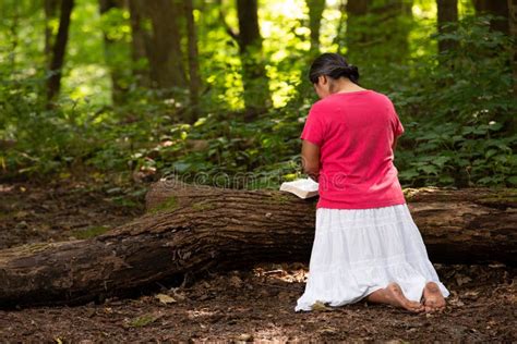 Woman Kneeling In Prayer