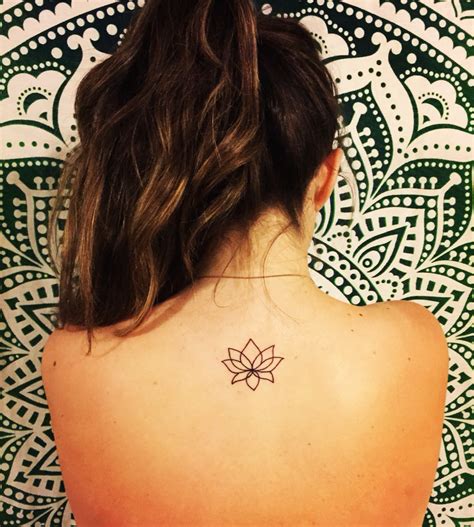 More images for tattoo lotusbloem » simplistic lotus tattoo on upper back | Tattoos, Neck ...