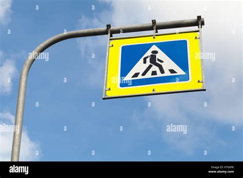 Pedestrian Crossing Square Blue And White Road Sign With Yellow Frame