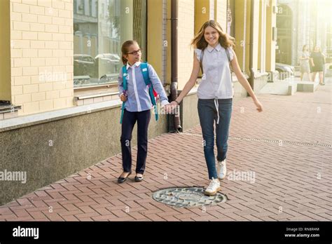 Children Girls Teens Go To School Holding Hands Stock Photo Alamy