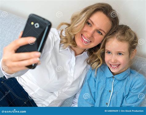 mother and daughter taking selfie stock image image of beautiful daughter 64809609
