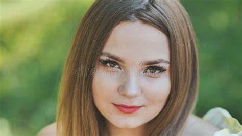 Portrait Of A Young Girl In A Park Close Up Of Her Face Stock Photo