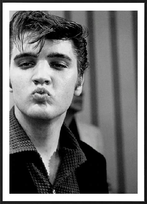 cool photograph in black and white of the iconic superstar elvis presley blowing a kiss this