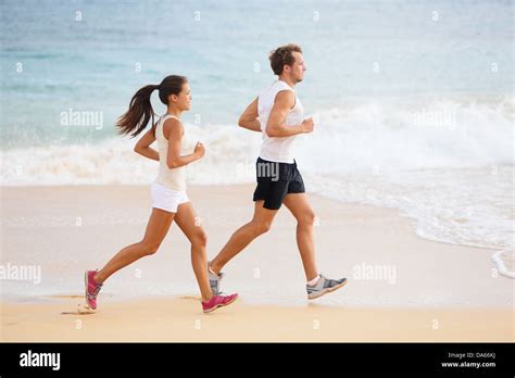 People Running Runner Couple On Beach Run Jogging Outdoors Fit Man