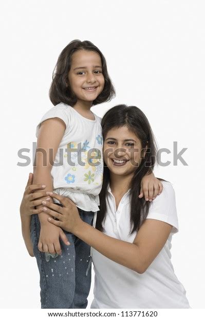 Happy Mother Hugging Her Daughter Smiling Stock Photo 113771620