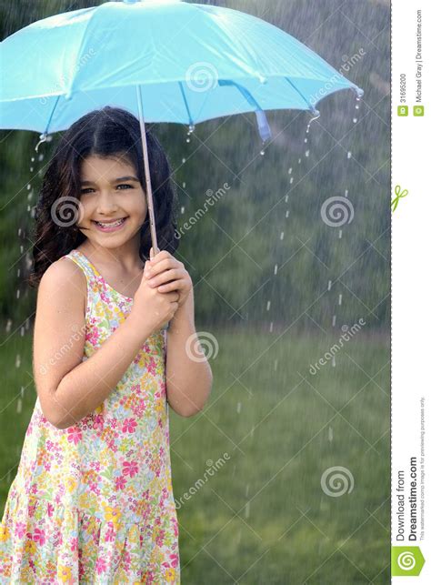 Young Girl Playing In Rain With Umbrella Stock Photo Image Of Drops