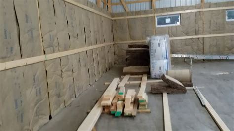 One could use foam board, fiberglass or spray foam. Pole Barn part 14: Lower insulation and framing almost ...