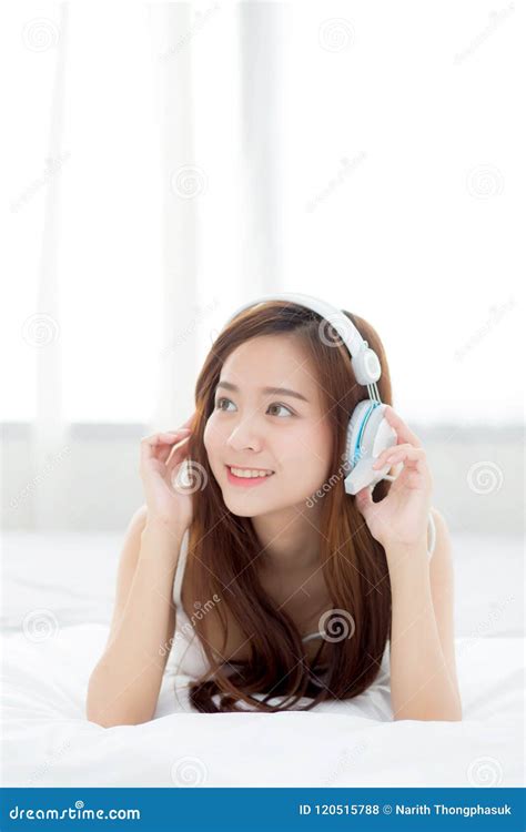 Beautiful Asian Young Woman Enjoy Listen Music With Headphone While