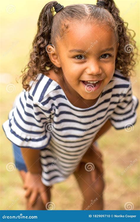 Cute Mixed Race Little Girl Laughing And Smiling Stock Photo Image