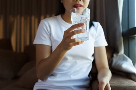 Premium Photo Close Up Of Female Drinking From A Glass Of Water