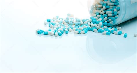 Comprimido De Cápsula De Antibiótico Azul Branco E Frasco De
