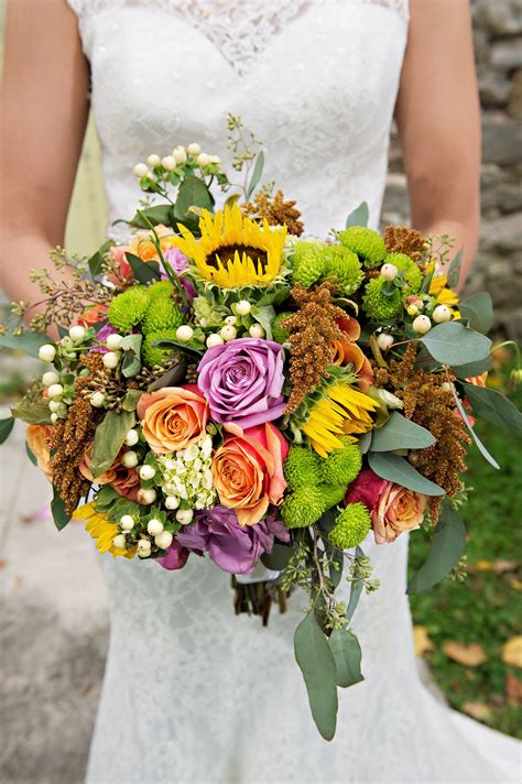 They're large like their namesake, are beautifully bright, and, perhaps best of all, are in. Fall Bridal Bouquet With Sunflowers and Eucalyptus