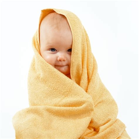 Premium Photo Baby In Yellow Towel