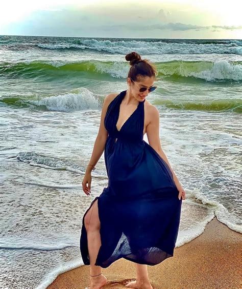 Hot And Sensual Poses Of Laxmi Raai At The Beach Glam Actress
