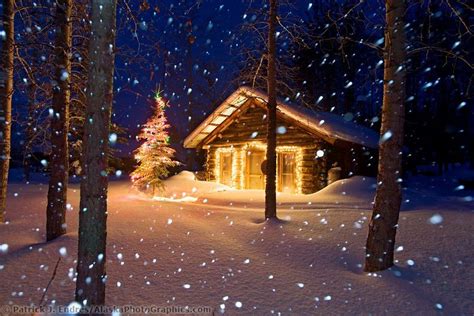 Winter Scene Of Heavy Falling Snow And A Historic Log Cabin With