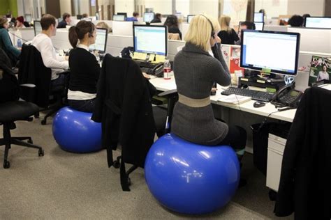 Sitting on exercise ball chairs in an office has pros and cons. Should You Use An Exercise Ball Instead Of Your Work Chair ...