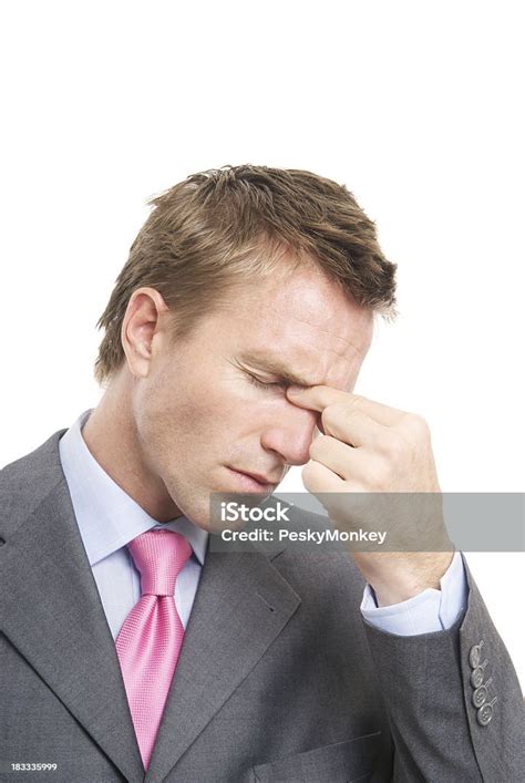 Stressed Businessman Eyes Closed Pinching Bridge Of Nose With Headache
