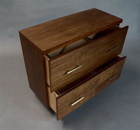 A filing cabinet (or sometimes file cabinet in american english) is a piece of office furniture usually used to store paper documents in file folders. Walnut Lateral File Cabinet - Hand-rubbed danish oil finish.