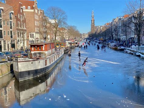 ice skating and fun on the frozen canals of amsterdam