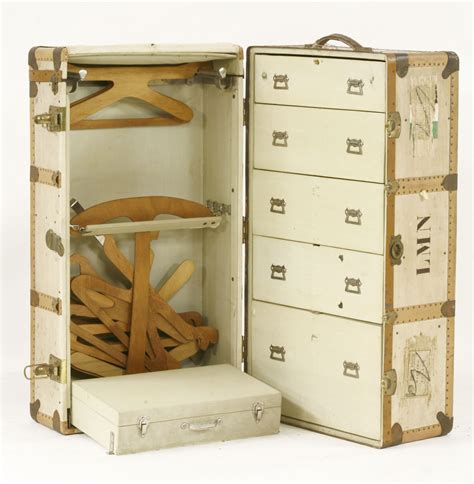 A Wardrobe Steamer Trunk Upright Drawers And A Case In Cream With