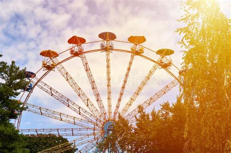 Amusement Park Ferris Wheel Blue Sky With Clouds Green Trees