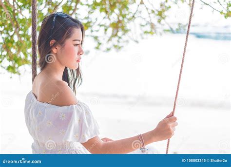 Asian Woman On White Dress Sitting On Swing At Beach People And Stock Image Image Of Face