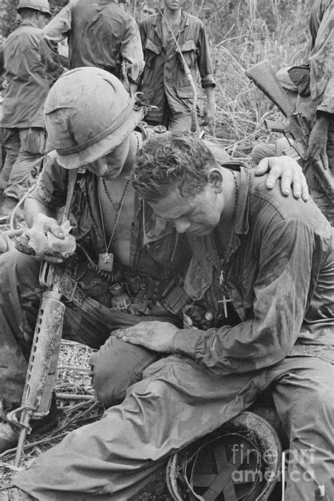 A Soldier Comforting Another Soldier Photograph By Bettmann