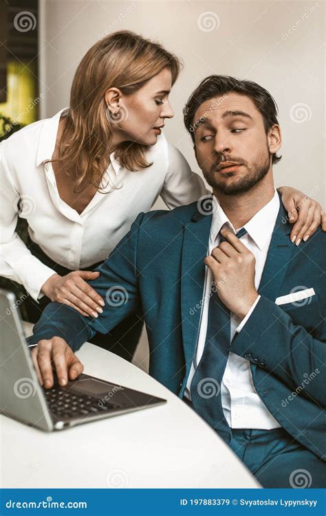 Female Head Of Office Embraced The Male Employee Working At His