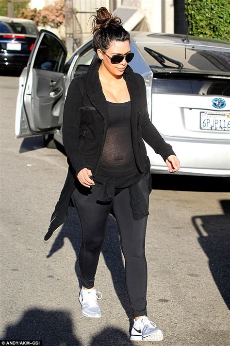 Kim Kardashian Gives A Glimpse Of Her Pregnant Belly In Sheer Top At