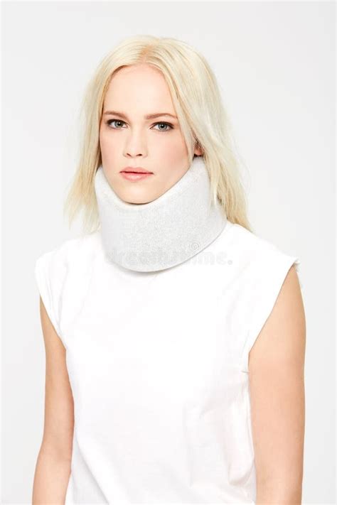 Woman With Neck Injury Medical Brace In Studio And Neck Pain Portrait