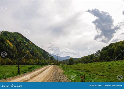 Dirt Road Passing Forested Hills Stock Photos Free And Royalty Free
