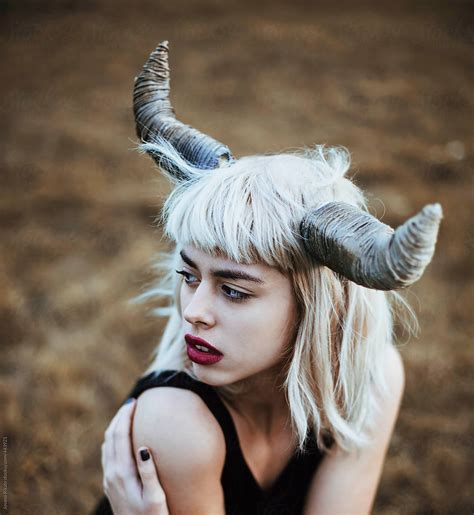 Portrait Of A Young Woman With Horns By Stocksy Contributor Jovana