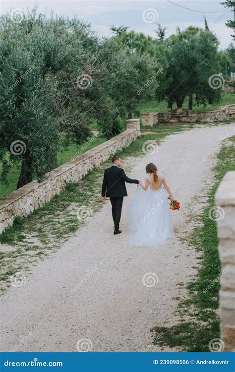happy stylish smiling couple walking in tuscany italy on their wedding day the bride and groom