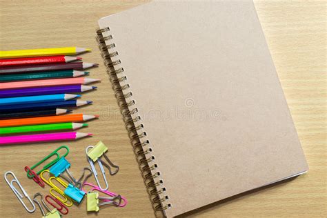 Blank Notebook On School And Frame Of Colorful School Supplies A Stock