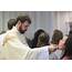 Newly Ordained Priests Distribute Communion During Their Ordination 