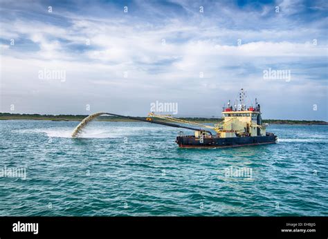 Barge Pipe Pushing Sand Onto The Beach Stock Photo Alamy